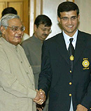 Prime Minister Atal Bihari Vajpayee presents a bat to Indian cricket team captain Sourav Ganguly